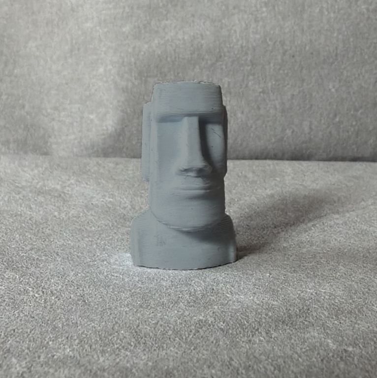 Weiße Ventilkappe in Form einer Moai-Statue